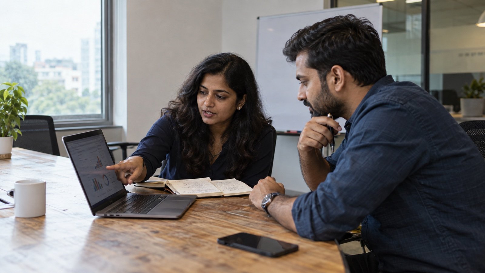 Indian marketing and sales professionals reviewing B2B performance metrics in a real office