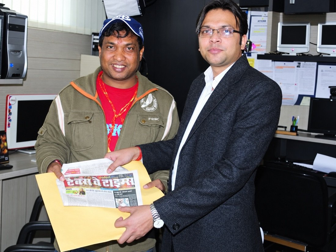Niranjan Mahawar sharing a publication during a professional meeting
