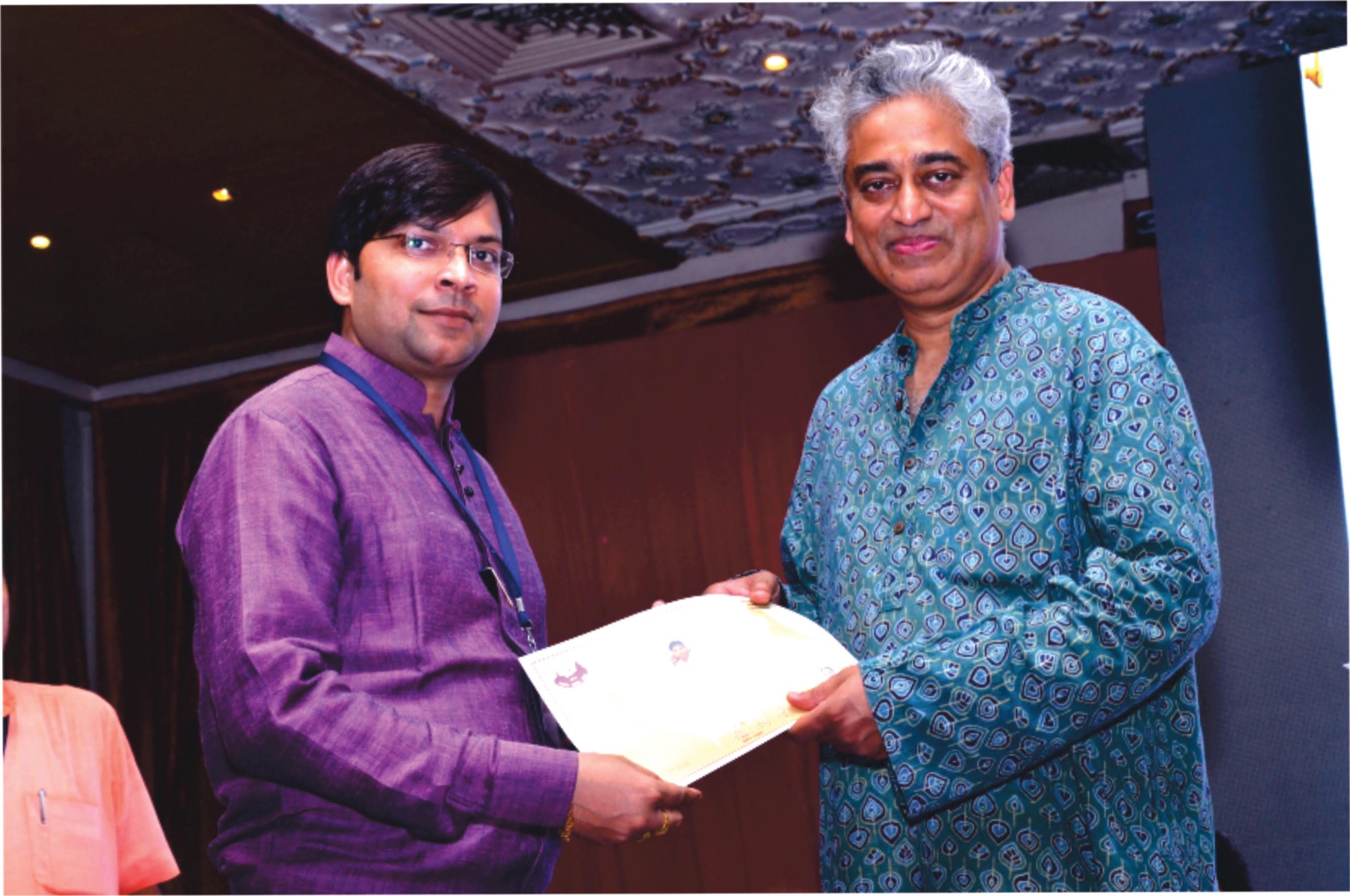 Niranjan Mahawar receiving recognition at an event
